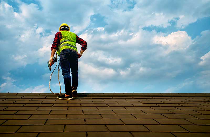 Worker with nail gun