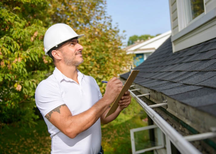 Man Doing Roof Inspection in Calgary